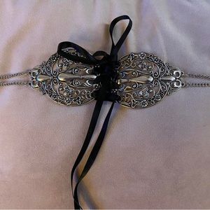 Silver metal choker with black ribbon